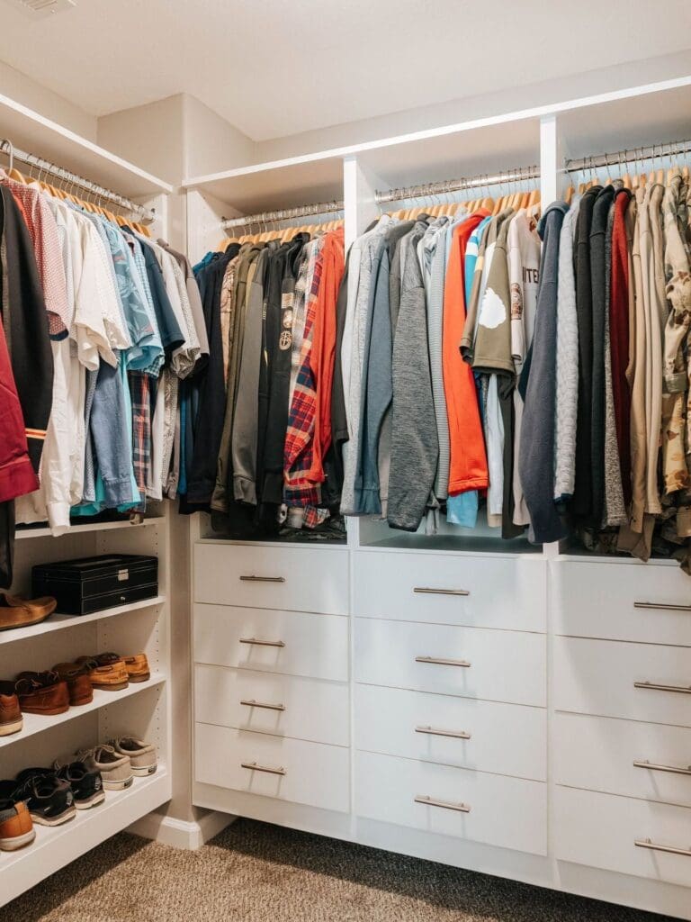 Custom walk-in closet in Clarksville with custom drawers, shelving, and hanging storage.